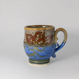 Mug in Flo Blue/Partridge by Juggler’s Cove Pottery